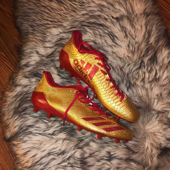 red and gold adidas football cleats